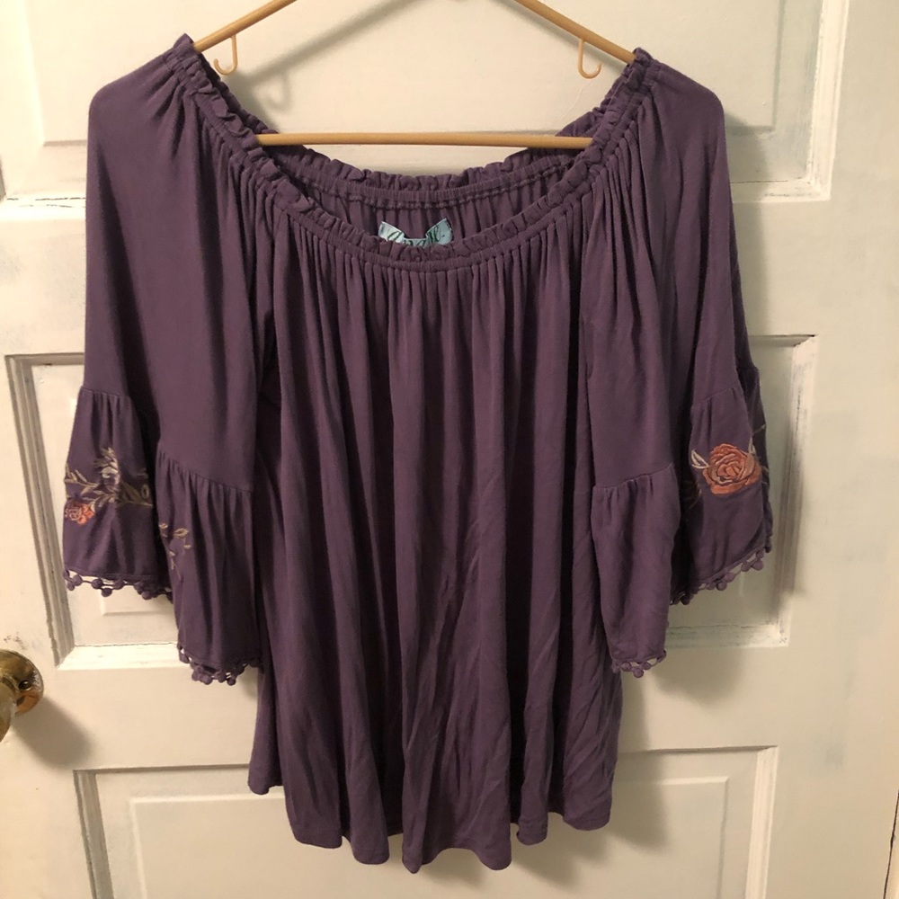 Francesca’s purple blouse